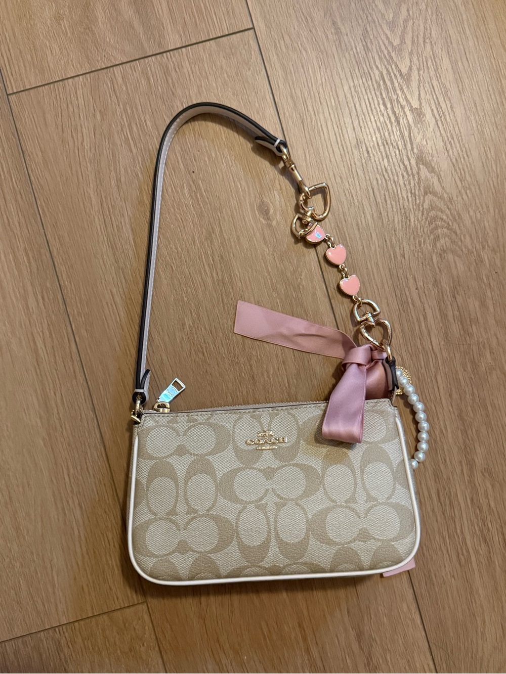 Coach Nolita Cream Signature Canvas Mini Wristlet with Pink Accents
